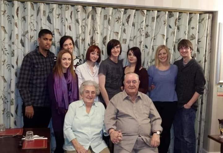 Grandy and his wife Betty with their grandchildren and their partners